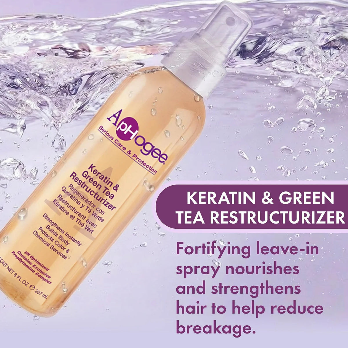 ApHogee Keratin & Green Tea Restructurizer spraysflaske omgivet af vandstænk på lilla baggrund.