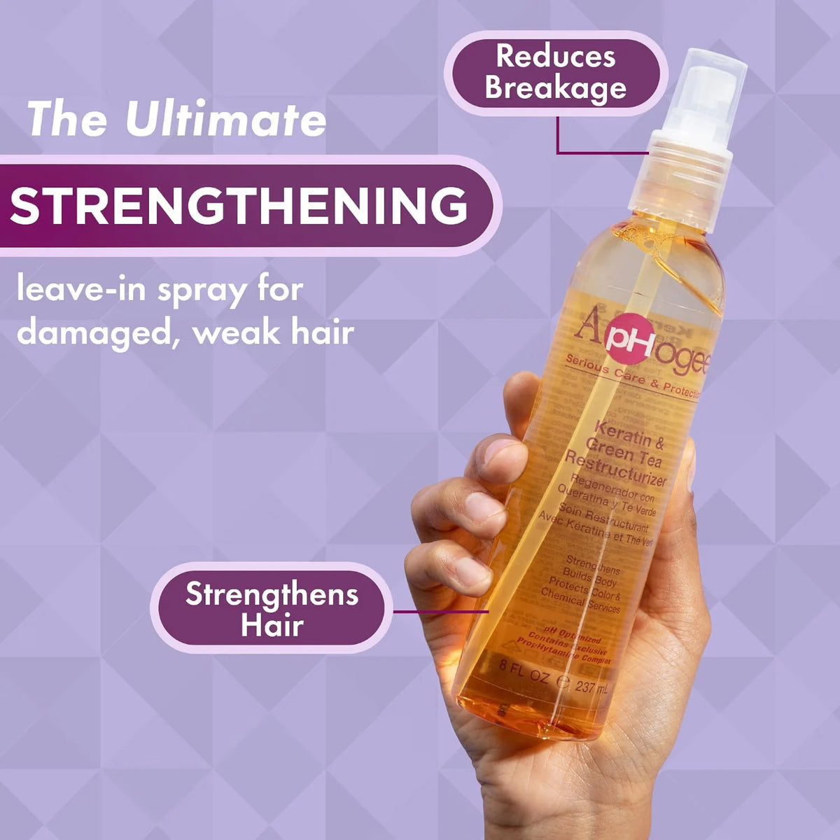 Hånd holder ApHogee Keratin & Green Tea Restructurizer spray, der reducerer brud og styrker svagt, skadet hår.