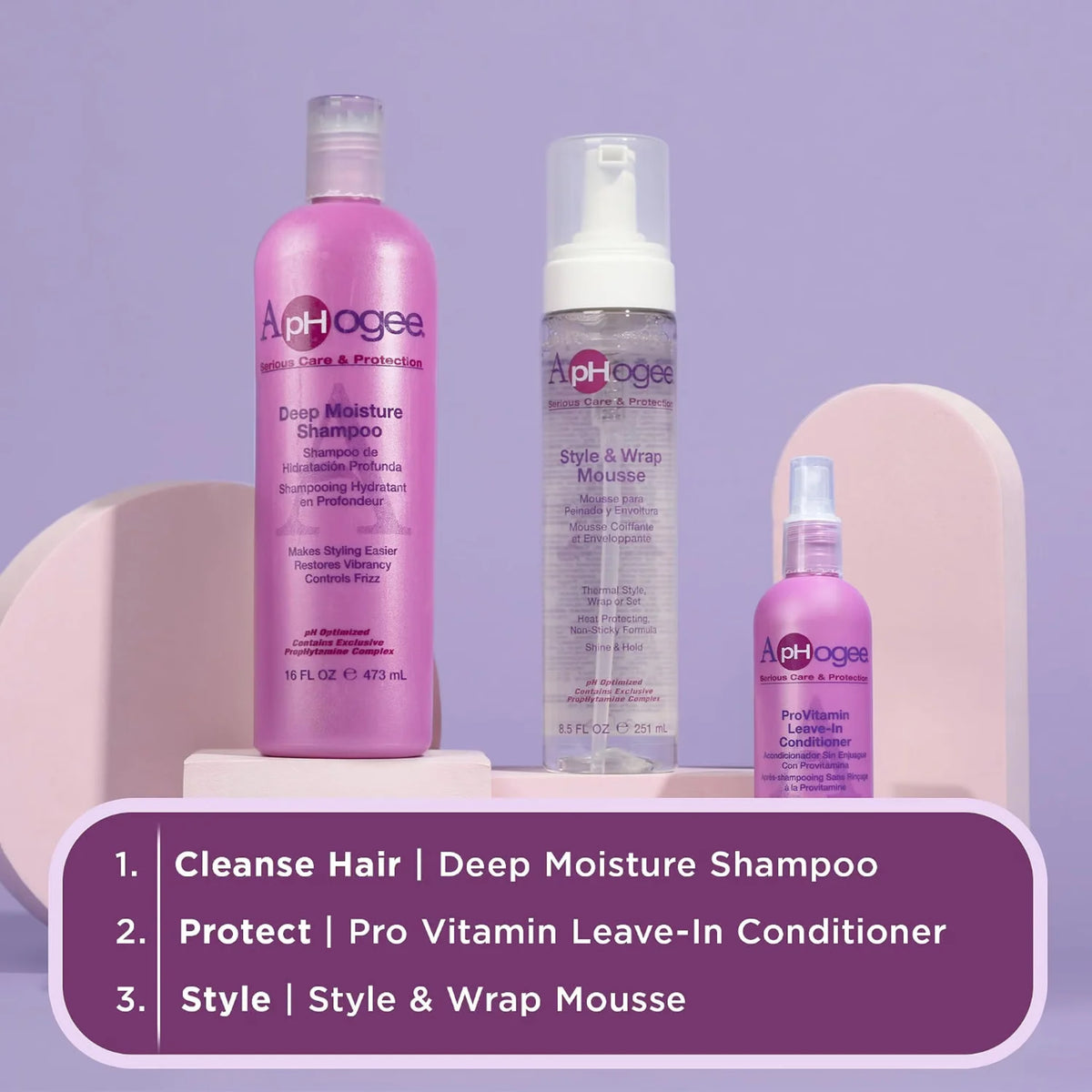 ApHogee hårplejesæt: Deep Moisture Shampoo, ProVitamin Leave-In Conditioner og Style & Wrap Mousse i lilla flasker med trinvis brugsanvisning.